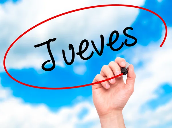 Людина почерком Jueves (четвер по-іспанськи) з чорний маркер — стокове фото