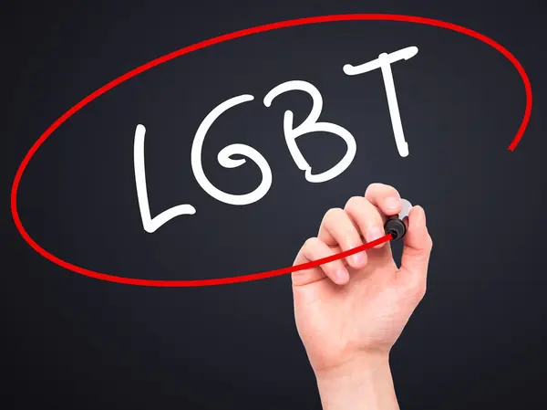 Man Hand writing LGBT Increase with black marker on visual scree — Stock Photo, Image