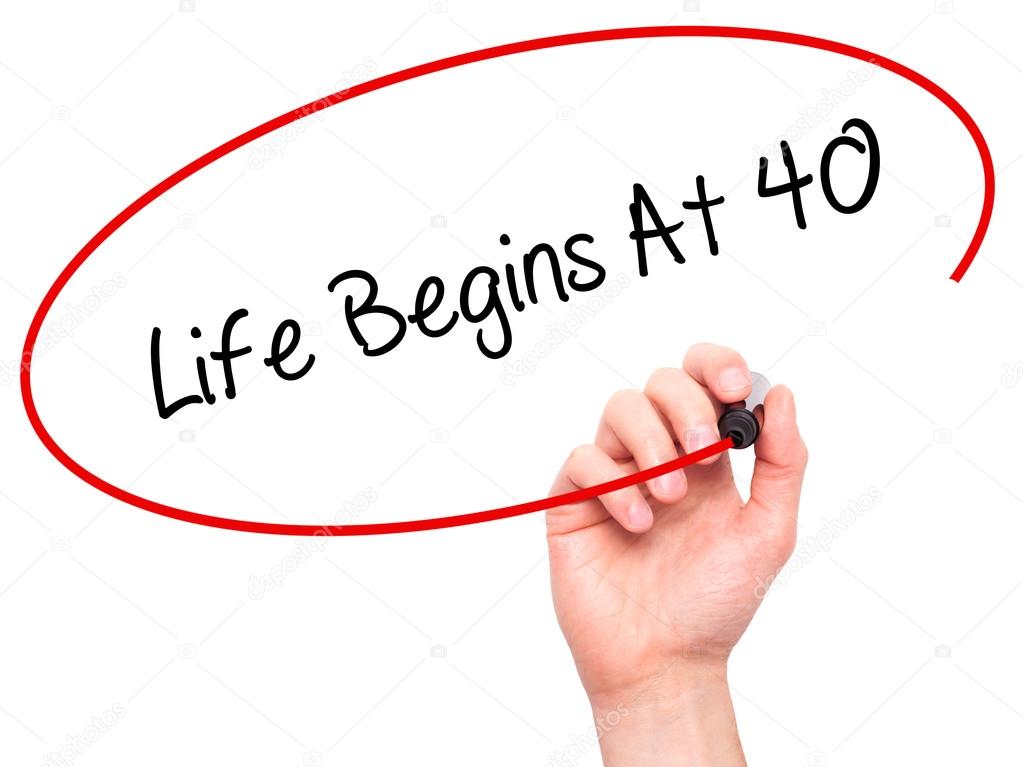 Man Hand writing Life Begins At 40  with black marker on visual 