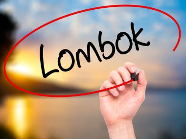 Adam el Lombok siyah kalemi ile görsel ekranda yazma.