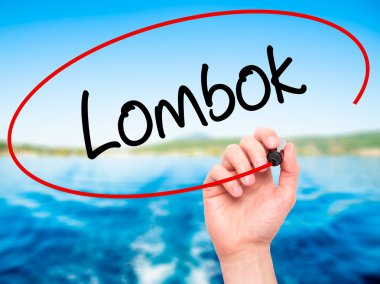 Adam el Lombok siyah kalemi ile görsel ekranda yazma.