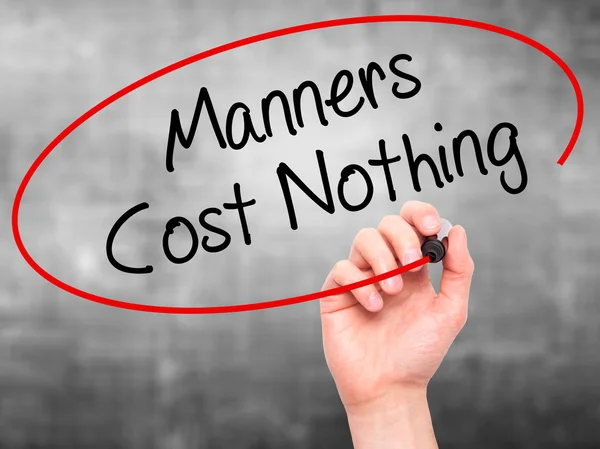 Man Hand writing Manners Cost Nothing with black marker on visua — Stock Photo, Image