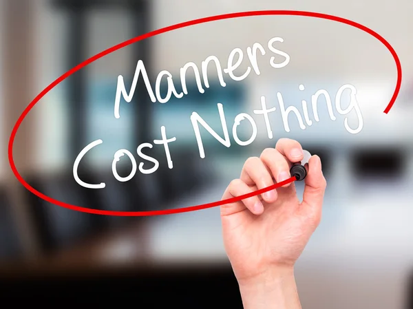 Man Hand writing Manners Cost Nothing with black marker on visua — Stock Photo, Image