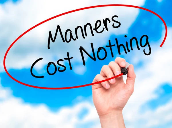 Man Hand writing Manners Cost Nothing with black marker on visua — Stock Photo, Image