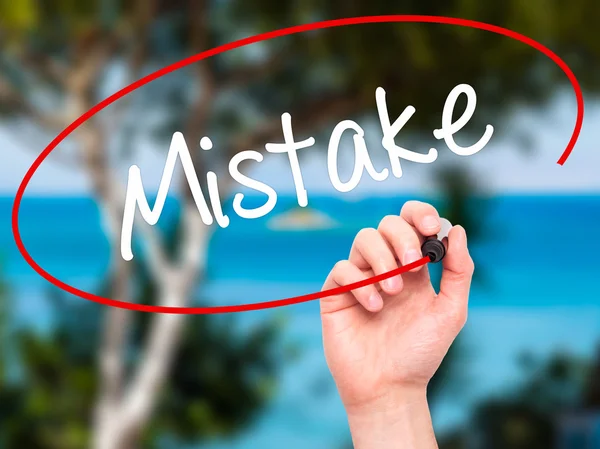 Man Hand writing Mistake with black marker on visual screen — Stock Photo, Image