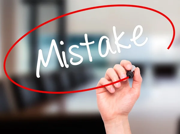 Man Hand writing Mistake with black marker on visual screen — Stock Photo, Image