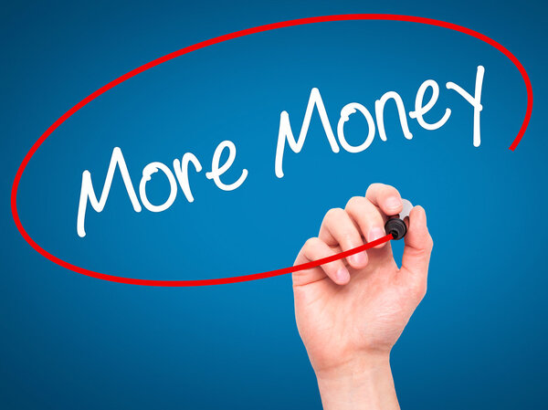 Man Hand writing More Money with black marker on visual screen