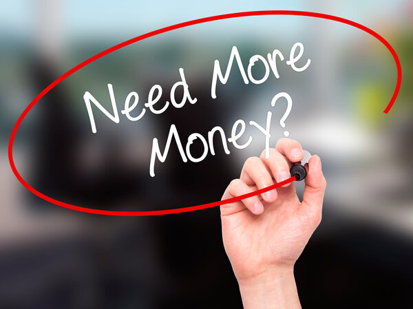 Man Hand writing Need More Money? with black marker on visual sc