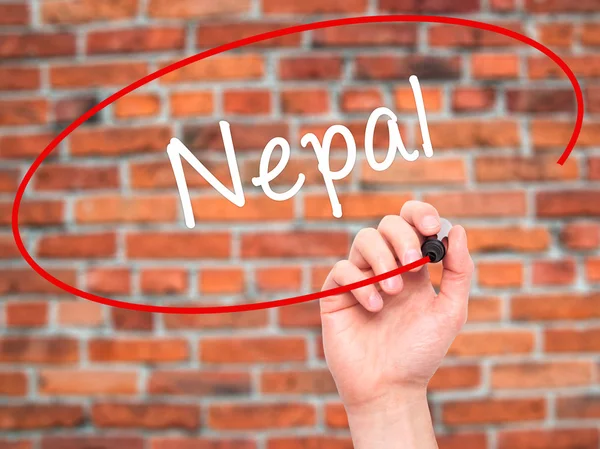 Man Hand menulis Nepal dengan penanda hitam pada layar visual — Stok Foto