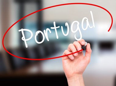 Man Hand writing  Portugal  with black marker on visual screen