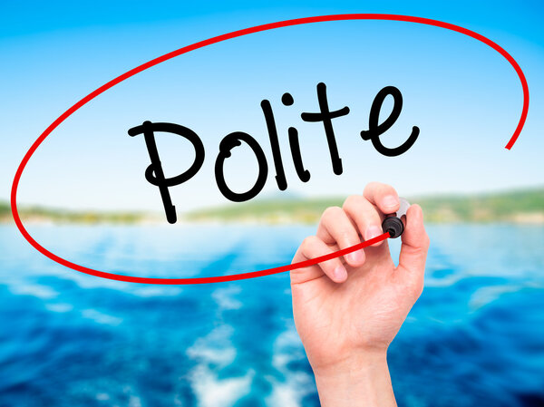 Man Hand writing Polite with black marker on visual screen