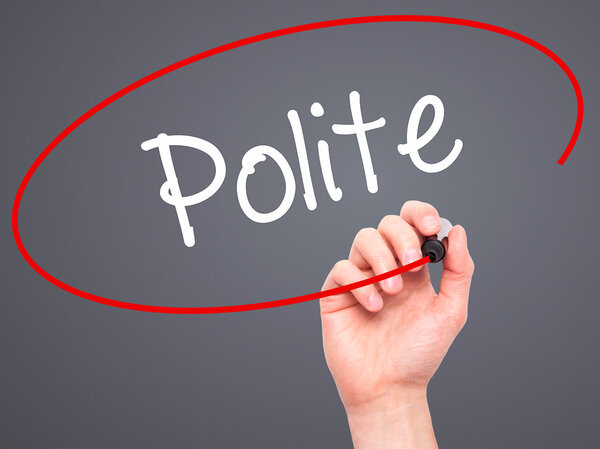 Man Hand writing Polite with black marker on visual screen