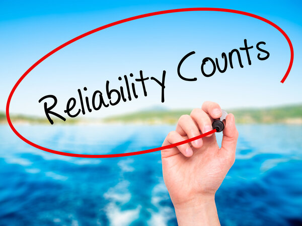 Man Hand writing Reliability Counts with black marker on visual 