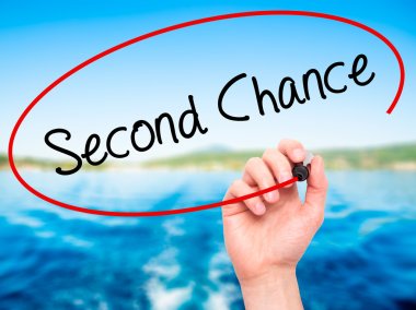 Man Hand writing Second Chance with black marker on visual scree clipart