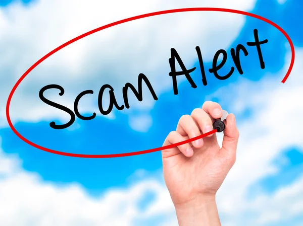 Man Hand writing Scam Alert  with black marker on visual screen — Stock Photo, Image