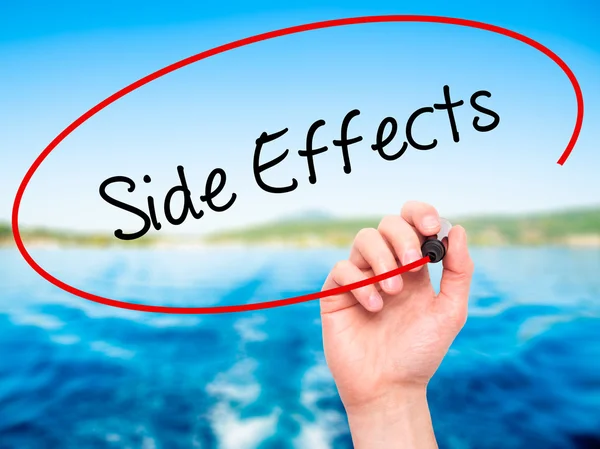 Man Hand writing Side Effects with black marker on visual screen — Stock Photo, Image