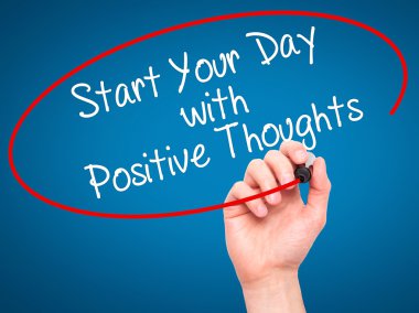 Man Hand writing Start your Dat with Positive Thoughts with blac
