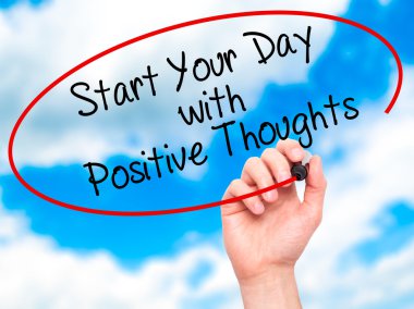 Man Hand writing Start your Dat with Positive Thoughts with blac