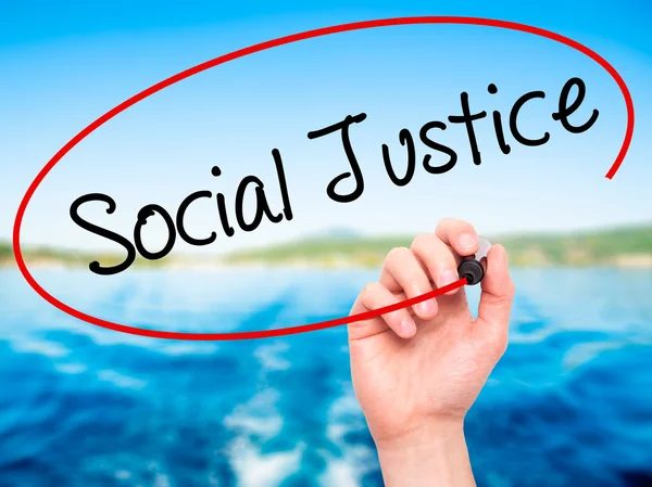 Man Hand writing Social Justice with black marker on visual scre — Stock Photo, Image