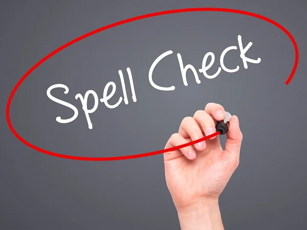 Man Hand menulis Spell Check dengan penanda hitam pada layar visual — Stok Foto