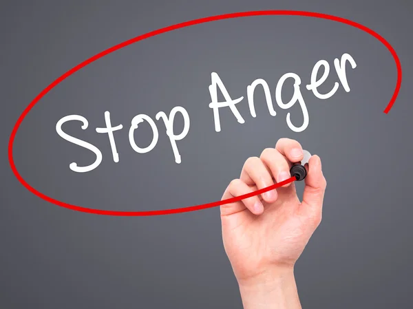 Man Hand writing Stop Anger with black marker on visual screen — Stock Photo, Image