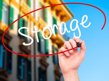 Man Hand writing Storage with black marker on visual screen