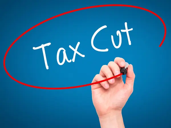 Man Hand writing Tax Cut with black marker on visual screen — Stock Photo, Image