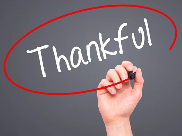 stock image Man Hand writing Thankful  with black marker on visual screen