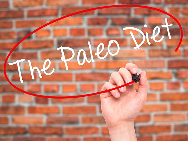 Man Hand writing The Paleo Diet with black marker on visual scre