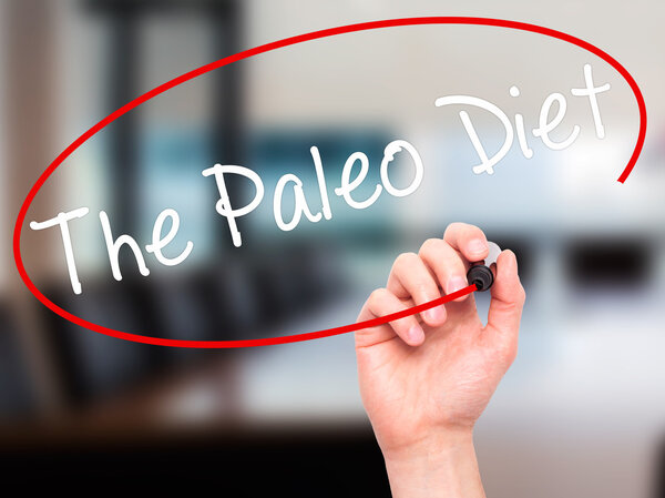 Man Hand writing The Paleo Diet with black marker on visual scre