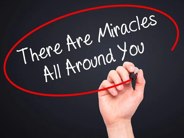 Man Hand writing There Are Miracles All Around You  with black m — Stock Photo, Image