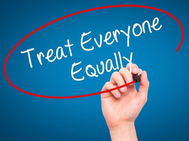 Man Hand writing Treat Everyone Equally with black marker on vis