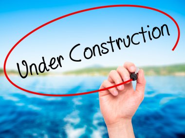 Adam el yapım aşamasında siyah kalemi ile görsel üzerinde yazılı. 