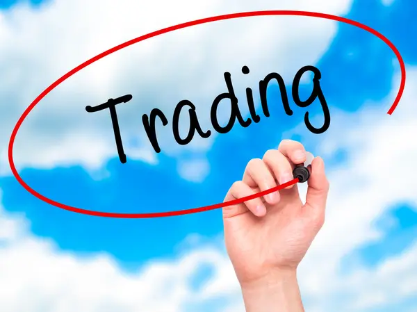 Man Hand writing Trading  with black marker on visual screen — Stock Photo, Image