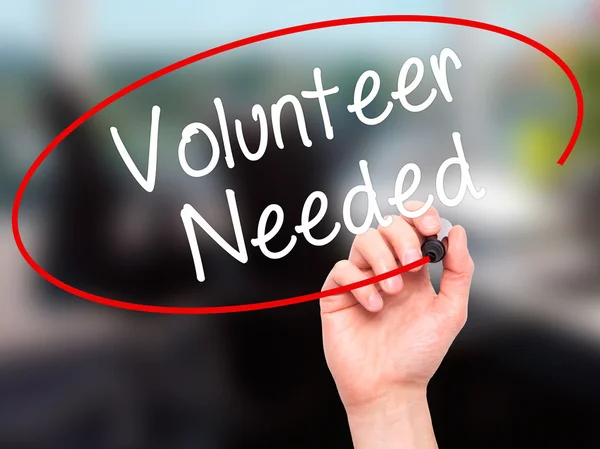 Man Hand writing Volunteer Needed with black marker on visual sc — Stock Photo, Image