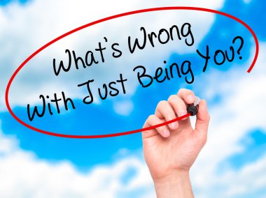 Man Hand writing What's Wrong With Just Being You? with black ma clipart