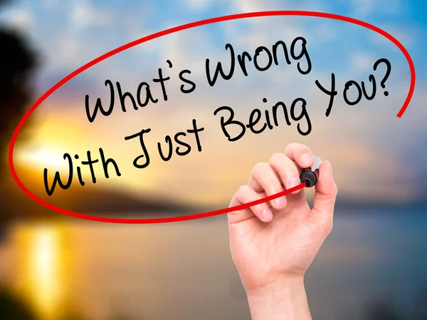 Man Hand writing What's Wrong With Just Being You? with black ma — Stock Photo, Image