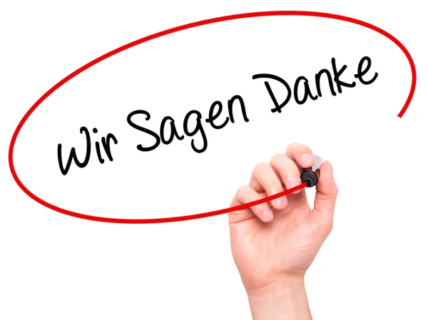 Людина рукописний текст почерк Wir Sagen Danke (ми сказати спасибі в Німецька) — стокове фото