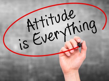 Man Hand writing Attitude is Everything with marker on transpare