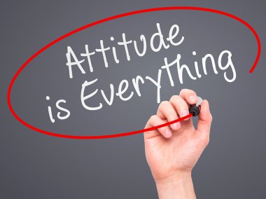 Man Hand writing Attitude is Everything with marker on transpare
