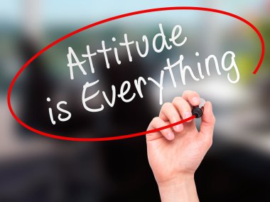 Man Hand writing Attitude is Everything with marker on transpare
