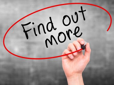 Man Hand writing Find out more with marker on transparent wipe b