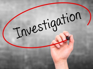 Man Hand writing Investigation with marker on transparent wipe b