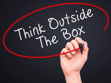 Man Hand writing Think Outside The Box with marker on transparen