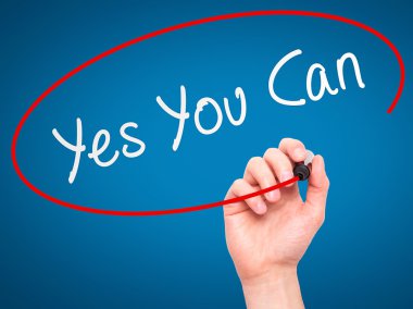 Man Hand writing Yes You Can with marker on transparent wipe boa
