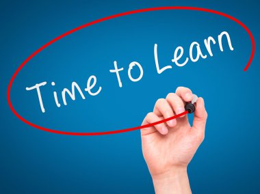 Man Hand writing Time to Learn with marker on transparent wipe b