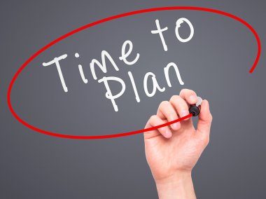 Man Hand writing Time to Plan with marker on transparent wipe bo