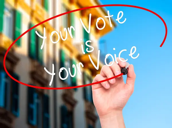 Man Hand writing Your Vote is Your Voice with black marker on vi — ストック写真