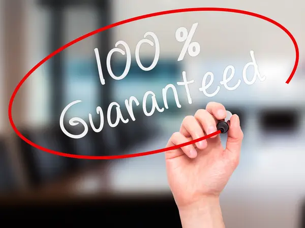 Man Hand writing 100 Percent Guaranteed with marker on transpare — Stock Photo, Image