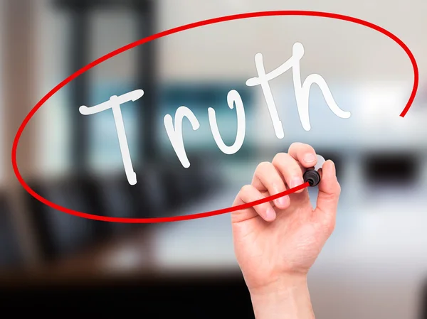 Man Hand writing Truth with marker on transparent wipe board — Stockfoto